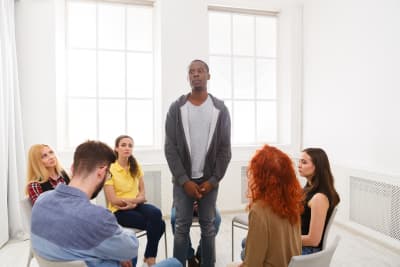 image of group of people doing counseling